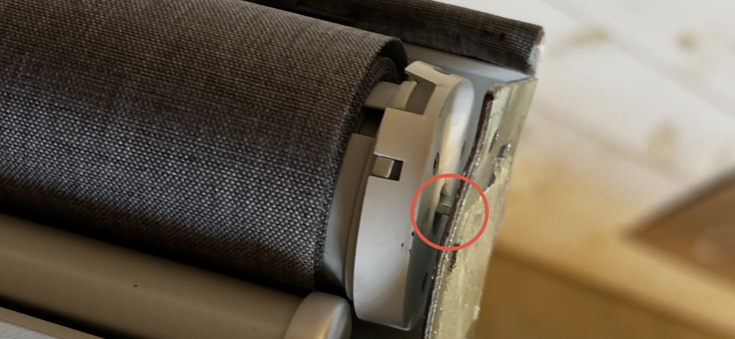 Close-up of motorized shade motor head slot and end cap pin alignment for limit setting