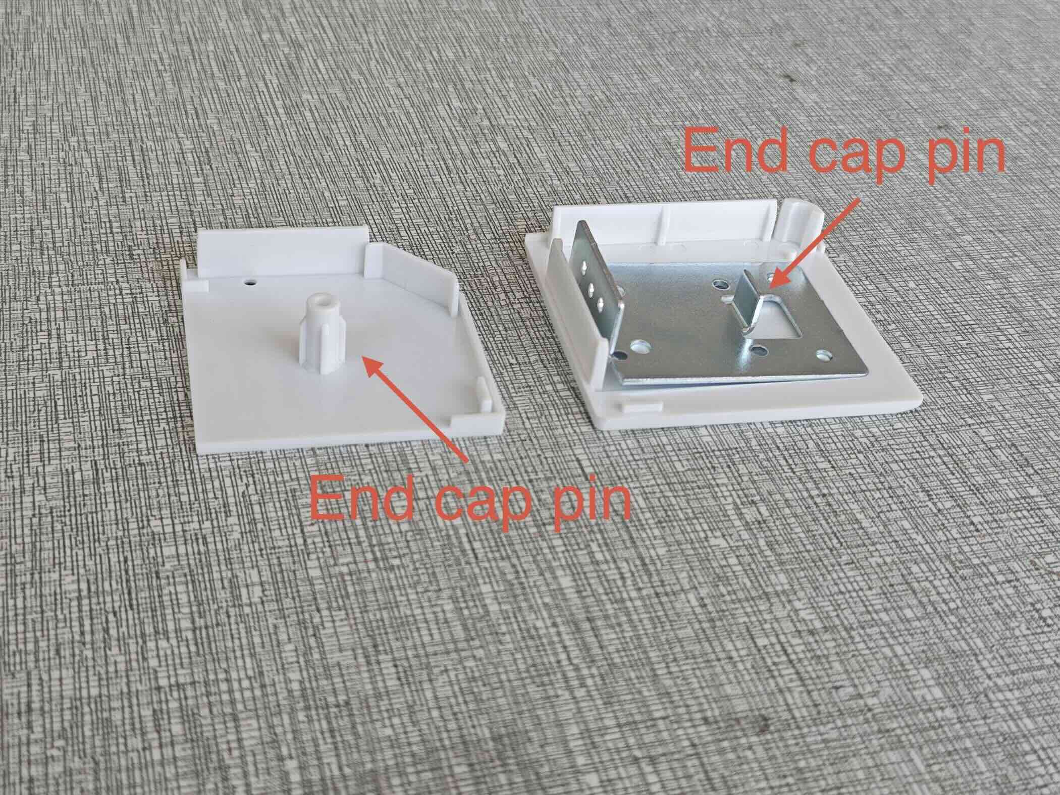 Close-up of motorized shade end cap pins for motor head alignment